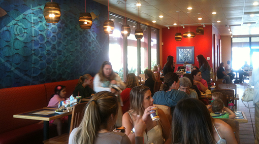 Rubio’s Carlsbad restaurant photo showing recycled cardboard lighting and School of Fish mural 